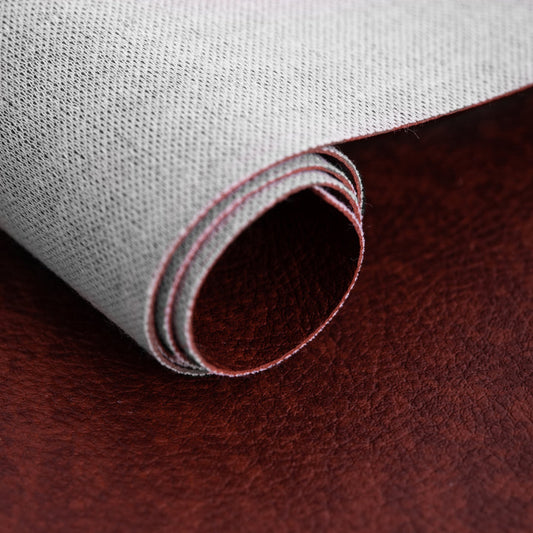 TESSUTO ECOPELLE MARTELLATA EFFETTO VINTAGE LEGGERMENTE ELASTICA